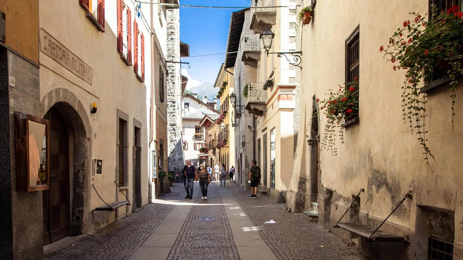 Via Roma at late morning, the old quarter small enough to walk across in the time it takes for an espresso to arrive.