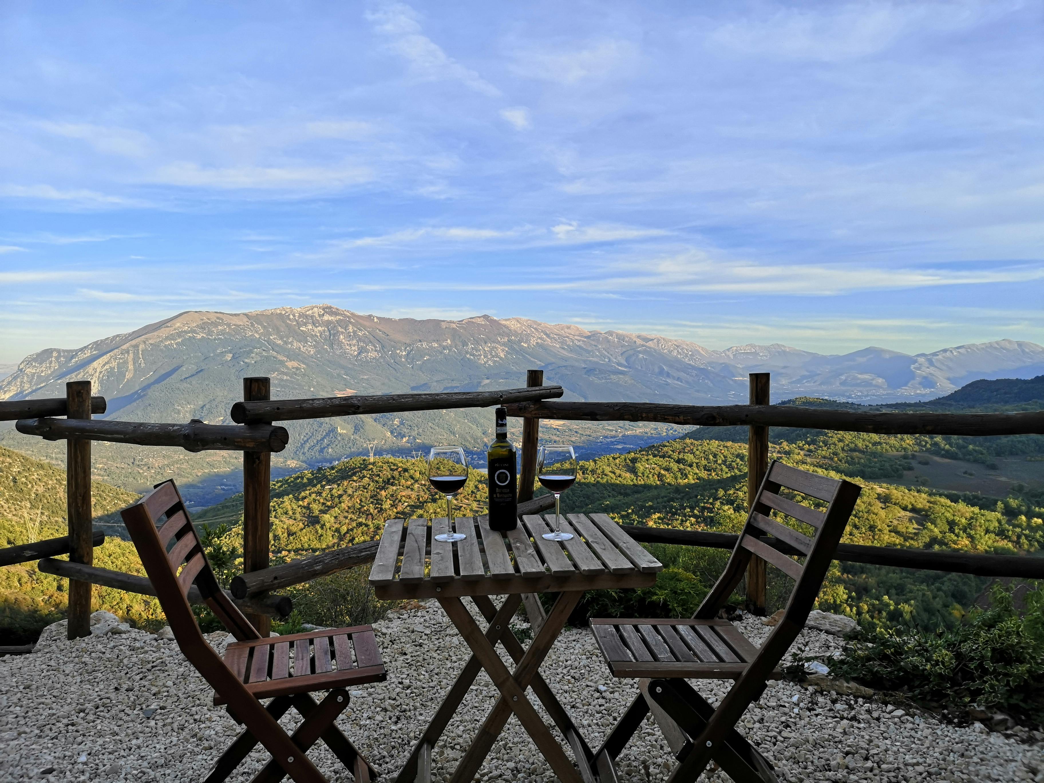 A terrace above the Val Badia with a glass of wine