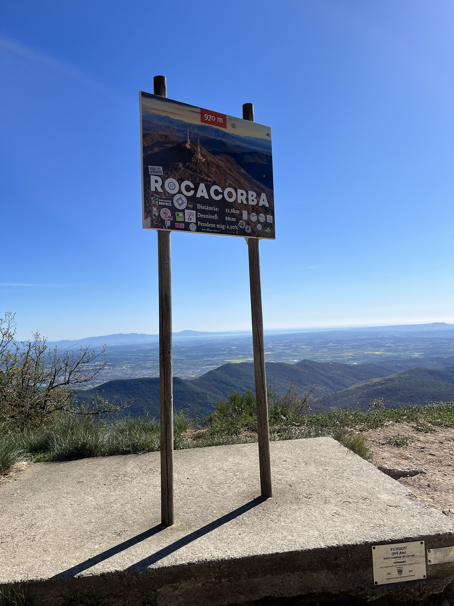 The Rocacorba climb, road disappearing into pine forest